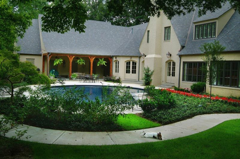 custom home plan exterior with swimming pool