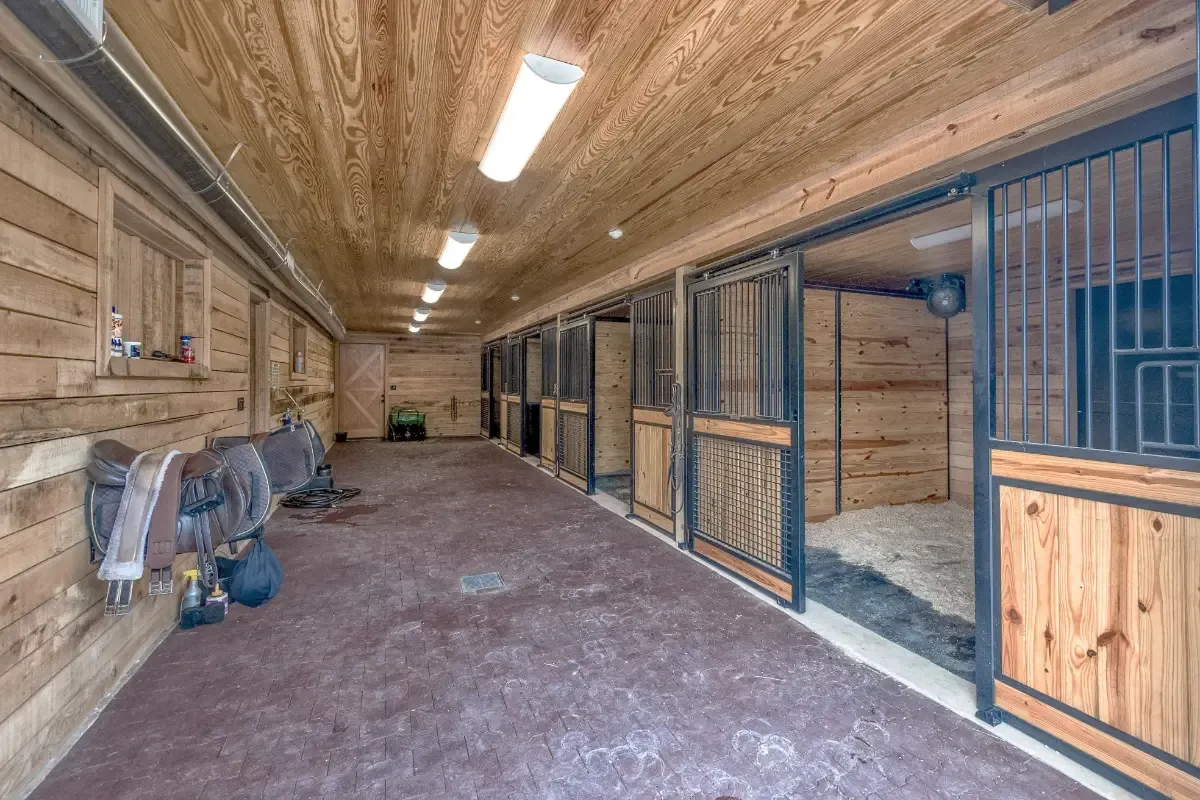 Horse stables are a part of this custom barn design with exceptional attention to detail.